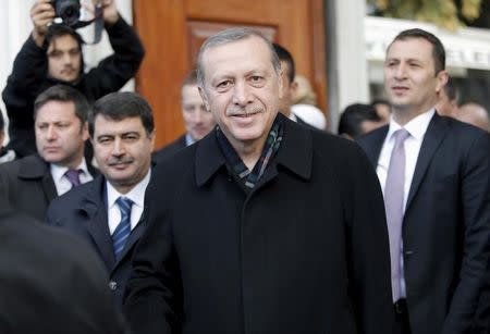 Turkish President Tayyip Erdogan smiles as he leaves from Eyup Sultan mosque in Istanbul, Turkey, November 2, 2015. REUTERS/Huseyin Aldemir