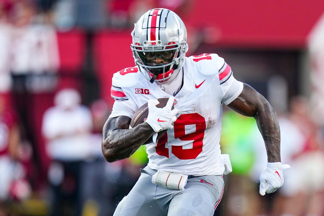 Sep 2, 2023; Bloomington, Indiana, USA; Ohio State Buckeyes running back Chip Trayanum (19) runs during the second half of the NCAA football game at Indiana University Memorial Stadium. Ohio State won 23-3.