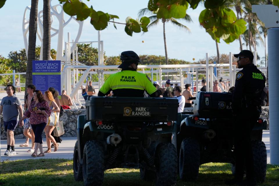 Miami Beach park rangers watch over crowds Tuesday, Feb. 27, 2024, in Miami Beach, Fla. Miami Beach officials have come up with a plan to curb spring breakers after three consecutive years of violence, including two fatal shootings last year. (AP Photo/Marta Lavandier) ORG XMIT: FLML303