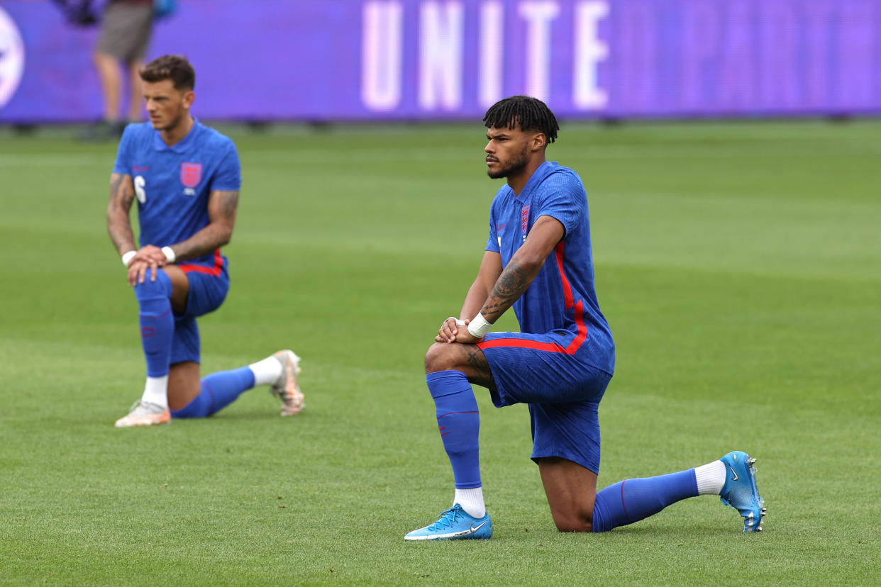 MIDDLESBROUGH, ENGLAND - JUNE 06: Tyrone Mings of England takes a knee in support of the Black Lives Matter movement prior to the international friendly match between England and Romania at Riverside Stadium on June 06, 2021 in Middlesbrough, England. (Photo by Eddie Keogh - The FA/The FA via Getty Images)