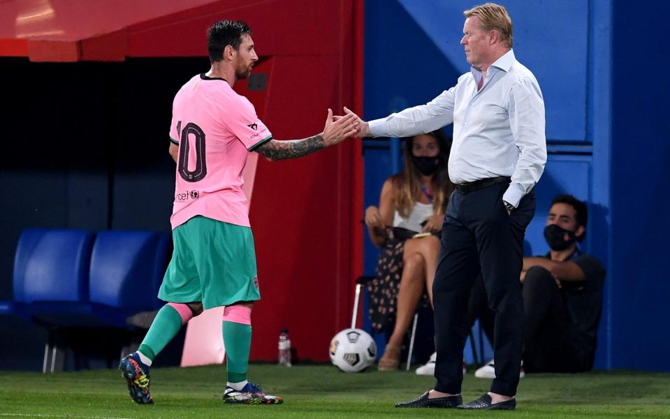 Ronald Koeman touches hands with Lionel Messi - GETTY IMAGES