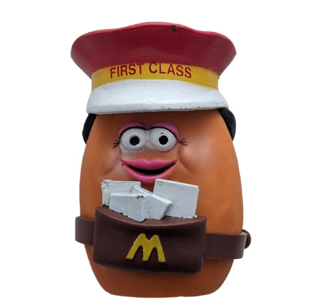 McDonald's Happy Meal Toy, a Potato Head character dressed as a mail carrier with a letter