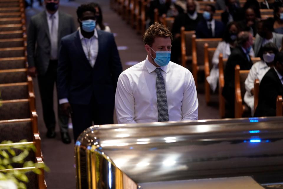 Houston Texans NFL player J.J. Watt, pauses by the casket of George Floyd  on June 9, 2020, at The Fountain of Praise church in Houston, Texas. - George Floyd will be laid to rest Tuesday in his Houston hometown, the culmination of a long farewell to the 46-year-old African American whose death in custody ignited global protests against police brutality and racism. Thousands of well-wishers filed past Floyd's coffin in a public viewing a day earlier, as a court set bail at $1 million for the white officer charged with his murder last month in Minneapolis. (Photo by David J. Phillip / POOL / AFP) (Photo by DAVID J. PHILLIP/POOL/AFP via Getty Images)