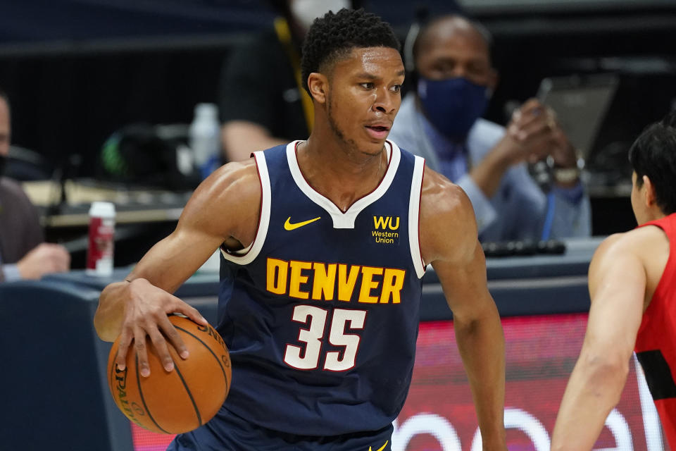 FILE - Denver Nuggets guard PJ Dozier (35) plays in the first half of an NBA basketball game against the Toironto Raptors on Thursday, April 29, 2021, in Denver. The Boston Celtics announced Thursday, Feb. 10, 2022, they've traded guard PJ Dozier and forward Bol Bol, along with a future second-round pick and cash to the Orlando Magic in exchange for a future second-round pick. Dozier and Bol came to Boston in January from Denver as part of a three-team trade. (AP Photo/David Zalubowski, File)