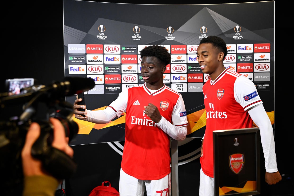 FRANKFURT AM MAIN, GERMANY - SEPTEMBER 19: Bukayo Saka and Joe Willock (L-R) of Arsenal FC gives an interview in the mixed zone after the UEFA Europa League group F match between Eintracht Frankfurt and Arsenal FC at Commerzbank Arena on September 19, 2019 in Frankfurt am Main, Germany. (Photo by Oliver Hardt - UEFA/UEFA via Getty Images)