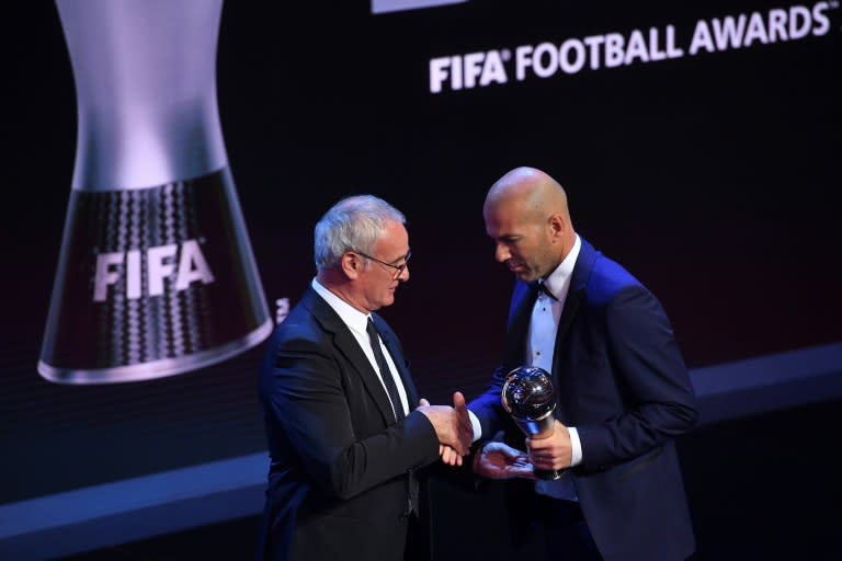 Real Madrid's French coach Zinedine Zidane (R) shakes hands with Italian manager of Nantes, Claudio Ranieri after winning the Best FIFA men's coach of 2017 award