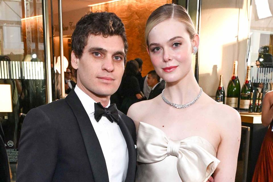 <p>Michael Kovac/Getty</p> Gus Wenner and Elle Fanning at The 81st Annual Golden Globe Awards on January 7, 2023.