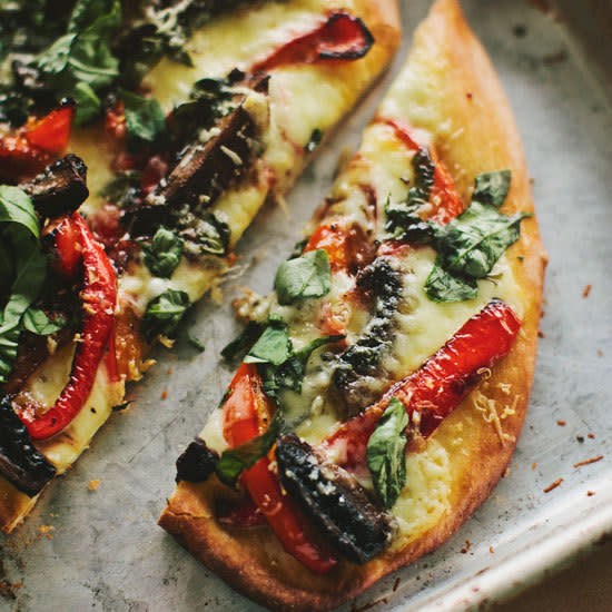 Portobello-Mushroom and Red-Pepper Pizza Depending on the size of appetites around your house, this substantial pizza with its meaty portobello mushrooms serves two very hungry people or four if it’s accompanied by a big salad. Get the Portobello-Mushroom and Red-Pepper Pizza recipe.