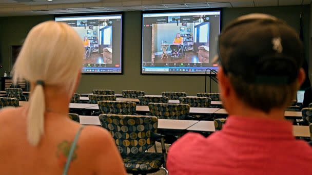 PHOTO: Members of the public watch testimony during the zoom broadcast of the Michael Carneal parole hearing at the West Kentucky Community and Technical College in Paducah, Ky., Sept. 19, 2022. (Timothy D. Easley/AP)