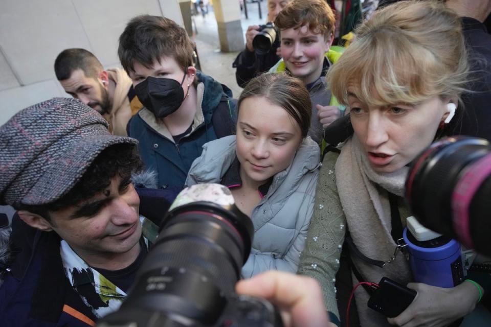 Greta Thunberg arrives at court to throng of photographers (AP)