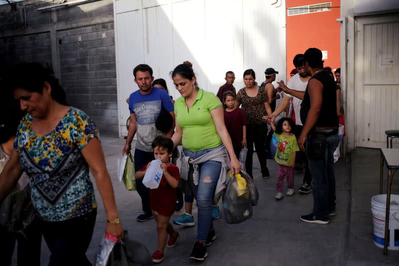 FILE PHOTO: Central American migrants, returned from the U.S. to Nuevo Laredo in Mexico under the Migrant Protection Protocol to wait for their court hearing for asylum seekers, are seen arriving to the "Casa INDI" migrant shelter in Monterrey