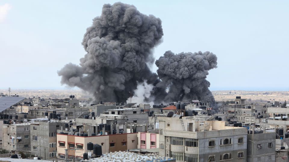 Smoke billows over Rafah, in southern Gaza, on Thursday. Israeli forces hammered the enclave for a sixth consecutive day. - Said Khatib/AFP/Getty Images
