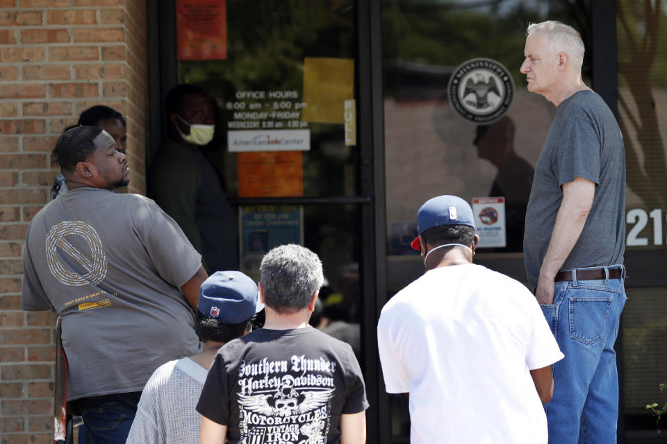 People wait outside a WIN job center in Pearl, Mississippi. (AP Photo/Rogelio V. Solis, File)