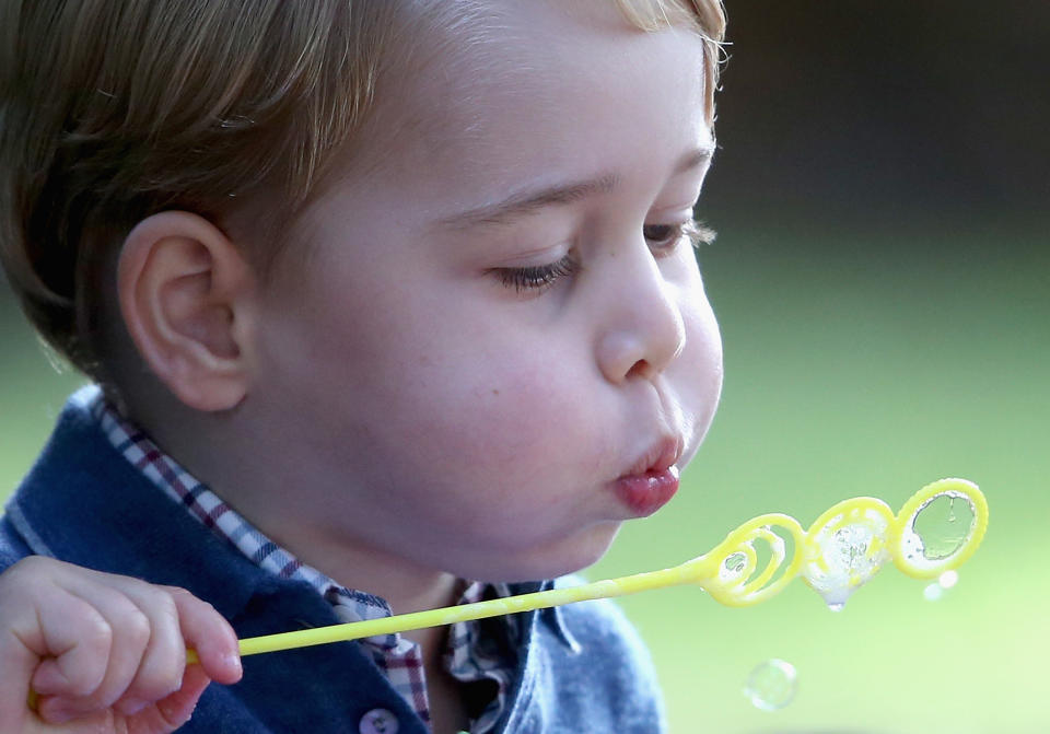 VICTORIA, BC - SEPTEMBER 29:  Prince George of Cambridge plays with bubbles at a children's party for Military families during the Royal Tour of Canada on September 29, 2016 in Victoria, Canada. Prince William, Duke of Cambridge, Catherine, Duchess of Cambridge, Prince George and Princess Charlotte are visiting Canada as part of an eight day visit to the country taking in areas such as Bella Bella, Whitehorse and Kelowna  (Photo by Chris Jackson - Pool/Getty Images)