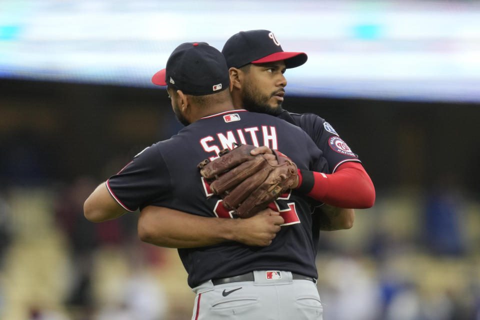 Washington Nationals third baseman Jeimer Candelario (9) celebrates a 10-6 win over the Los Angeles Dodgers in a baseball game in Los Angeles, Wednesday, May 31, 2023. (AP Photo/Ashley Landis)