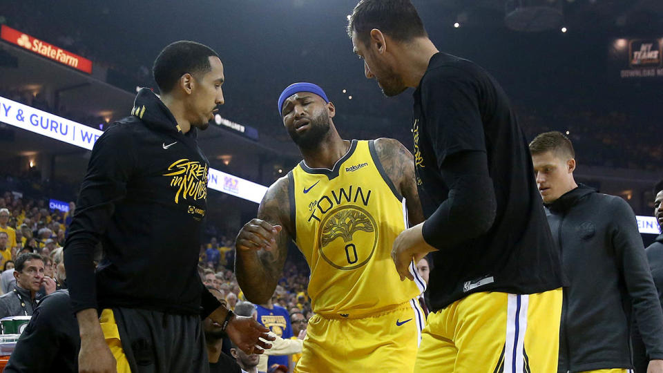 DeMarcus Cousins limps off. (Photo by Ezra Shaw/Getty Images)