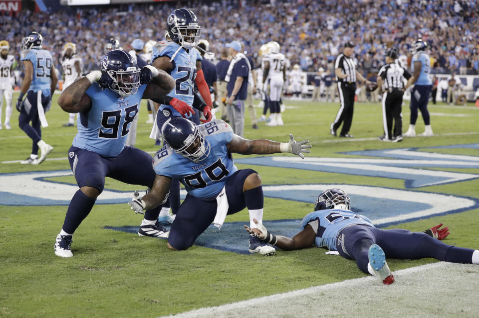 Tennessee Titans defenders Tennessee Titans defenders Jeffery Simmons (98) and Jurrell Casey (99) celebrate after stopping the Los Angeles Chargers on their final drive of the game in the fourth quarter of an NFL football game Sunday, Oct. 20, 2019, in Nashville, Tenn. The Titans won 23-20. (AP Photo/James Kenney)