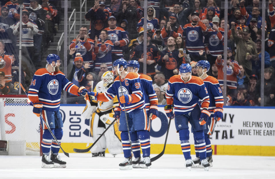 Edmonton Oilers celebrate a goal against the Pittsburg Penguins during the third period of an NHL hockey game in Edmonton, Alberta, on Sunday March 3, 2024. (Jason Franson/The Canadian Press via AP)