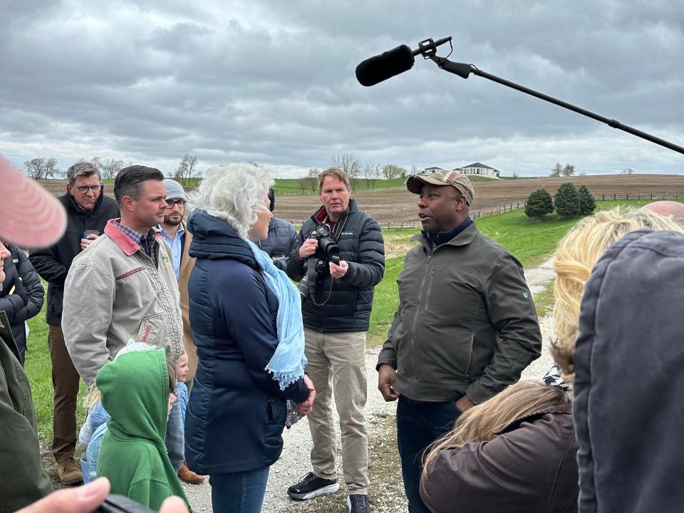 Sen. Tim Scott of South Carolina speaks with the owner of a farm in Cumming, Iowa on April 22, 2023.