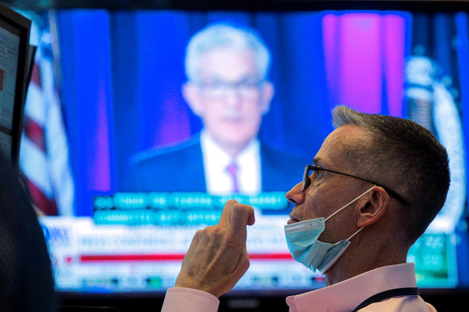 A screen displays a statement by Federal Reserve Chair Jerome Powell following the U.S. Federal Reserve&#39;s announcement as a trader works on the trading floor of the New York Stock Exchange (NYSE) in New York City, U.S., September 22, 2021.  REUTERS/Brendan McDermid
