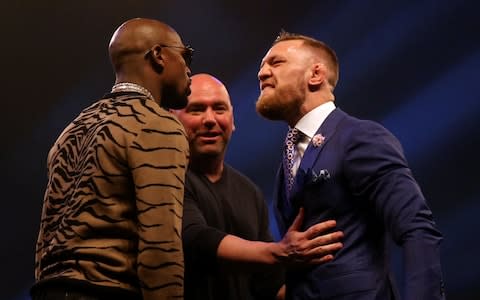 Connor McGregor (right) and Floyd Mayweather  - Credit: PA
