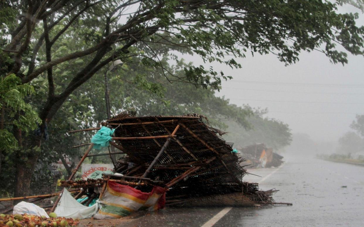 A record 1.2 million people were evacuated in Odisha ahead of the storm making land today - AP