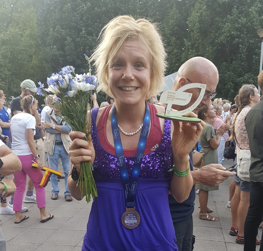 Claire Danson celebrates third place in the European triathlon age group championships and 5th place overall.