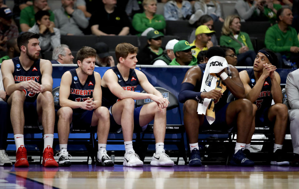 Liberty players sit on the bench during their loss against Virginia Tech during a second-round game in the NCAA men's college basketball tournament Sunday, March 24, 2019, in San Jose, Calif. (AP Photo/Ben Margot)