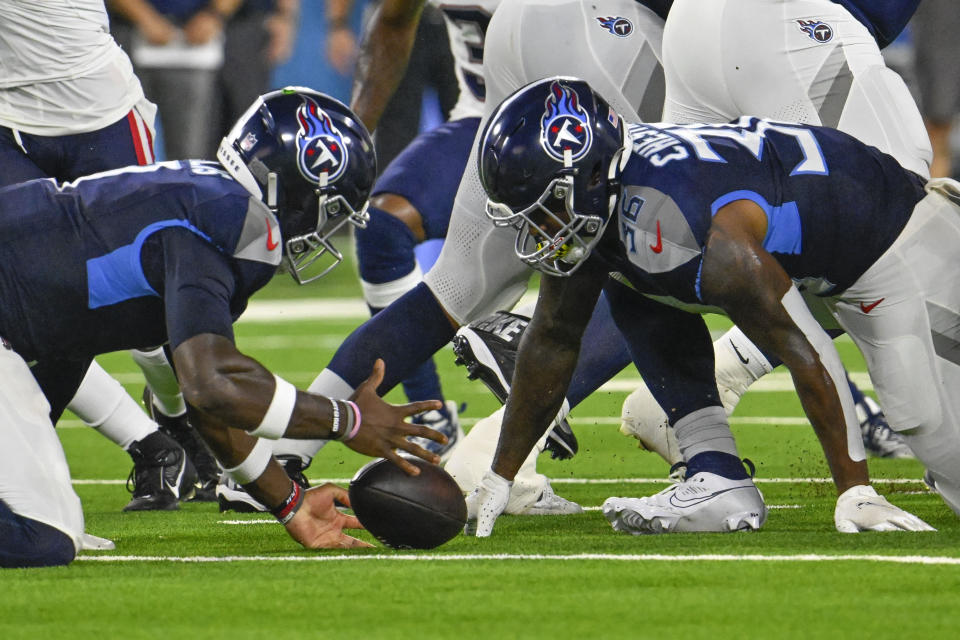 Tennessee Titans quarterback Malik Willis (7) recovers a fumble in the first half of an NFL preseason football game against the New England Patriots Friday, Aug. 25, 2023, in Nashville, Tenn. (AP Photo/John Amis)