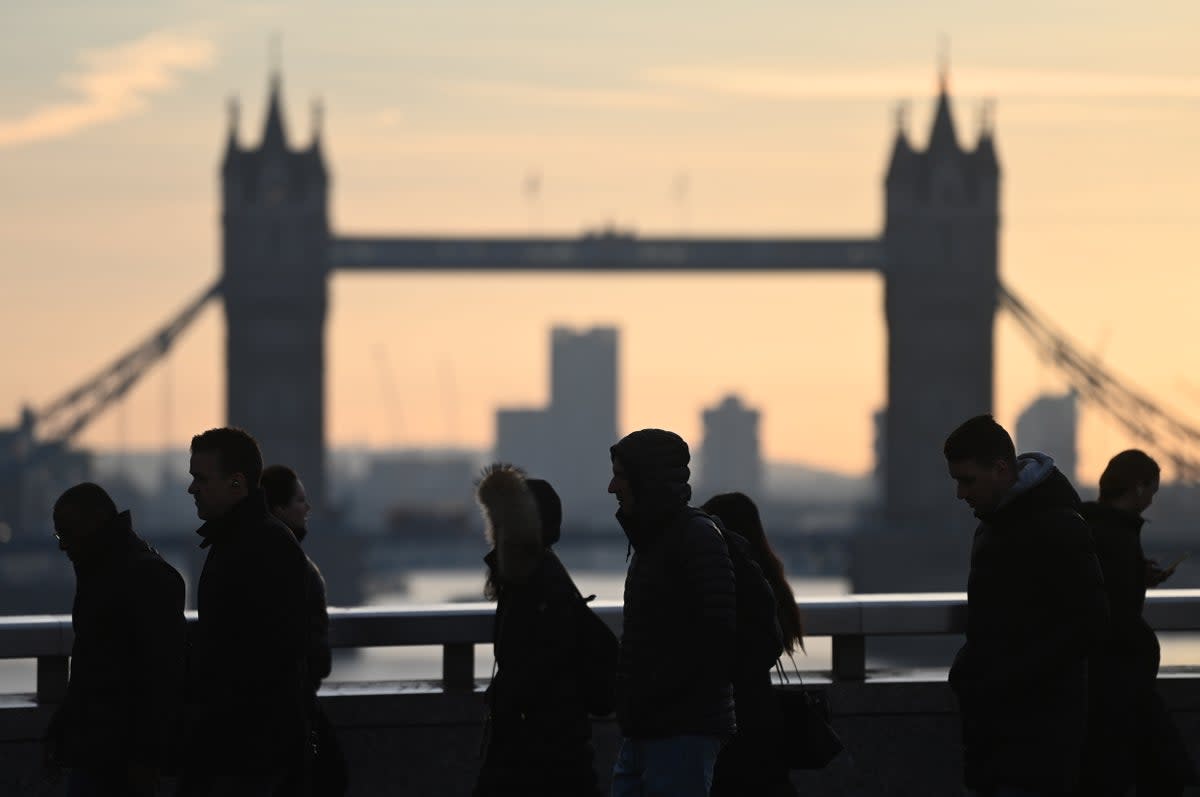 10 February 2023: Commuters pass Tower Bridge in London (EPA)