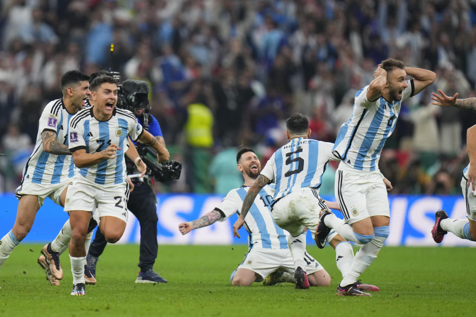 Argentinian players celebrate after winning penalty shootout during the World Cup final soccer match between Argentina and France at the Lusail Stadium in Lusail, Qatar, Sunday, Dec. 18, 2022. (AP Photo/Petr David Josek)