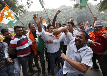 Supporters of Congress party celebrate after learning the initial results outside the party headquarters in New Delhi, India, November 8, 2015. REUTERS/Anindito Mukherjee