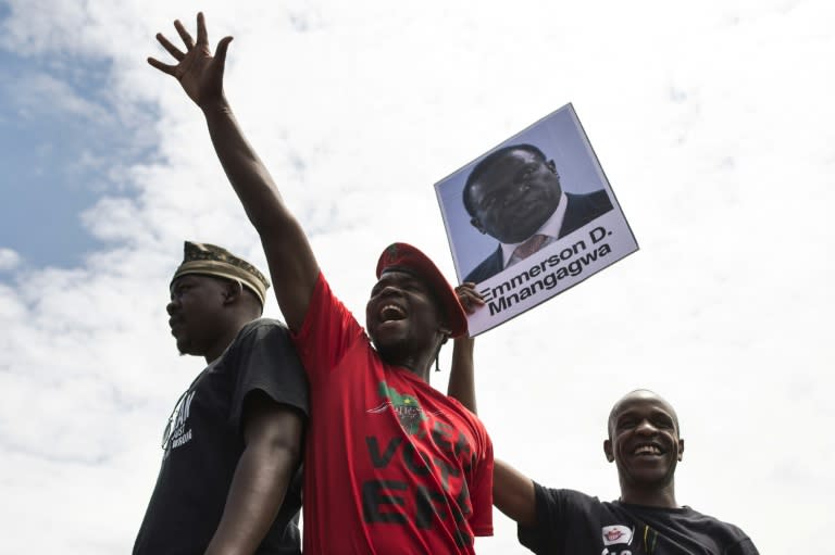 University of Zimbabwe students with a portrait of ousted vice president Emmerson Mnangagwa at a demonstration in Harare on Monday