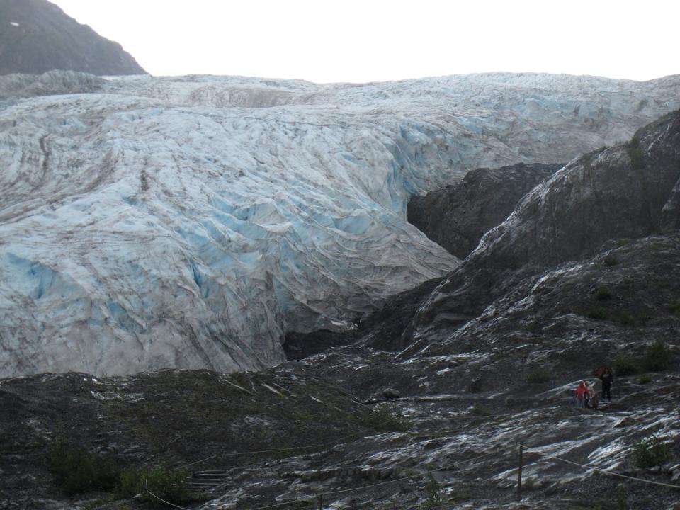 This photo taken Aug. 4, 2012, shows tourists walking to Exit Glacier in Kenai Fjords National Park just outside Seward, Alaska. The glacier is a popular destination for cruise ship passengers visiting the port city of Seward, about 110 miles south of Anchorage, Alaska. (AP Photo/Mark Thiessen)