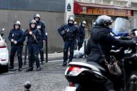 French CRS riot police secure the area after a man was shot dead at a police station in the 18th district in Paris, France January 7, 2016. REUTERS/Philippe Wojazer