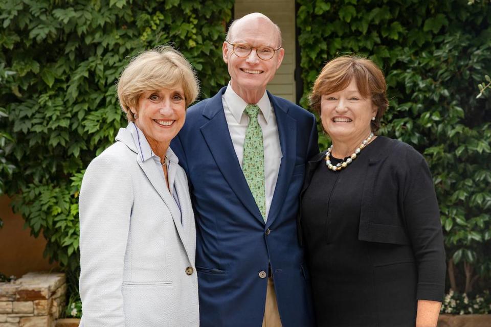 Walter Hussman (center) and his wife, Ben, (right) meet with Susan King, the dean of UNC’s School of Media and Journalism (left). The School of Media and Journalism will now be known as the Hussman School of Journalism and Media following a $25 million gift by alumnus Walter Hussman.