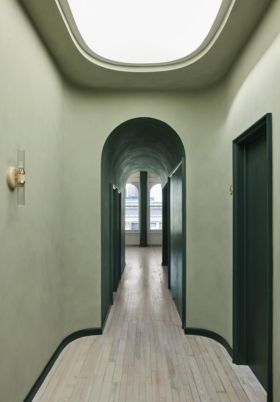 A passageway painted in light and dark green