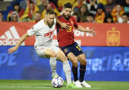 FILE - Spain's Jordi Alba, right, challenges for the ball with Switzerland's Silvan Widmer during the UEFA Nations League soccer match between Spain and Switzerland, at the Benito Villamarin Stadium, in Seville, Spain, Saturday, Sept. 24, 2022. (AP Photo/Jose Breton, File)