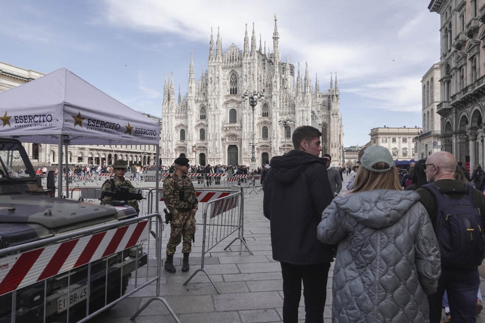 Soldiers patrol in front of Milan gothic cathedral in Milan, Monday, March 25, 2024. Italy followed France Monday in stepping up its security stance following the attack on a suburban Moscow concert hall and the claim of responsibility by an affiliate of the Islamic State group. (AP Photo/Luca Bruno)