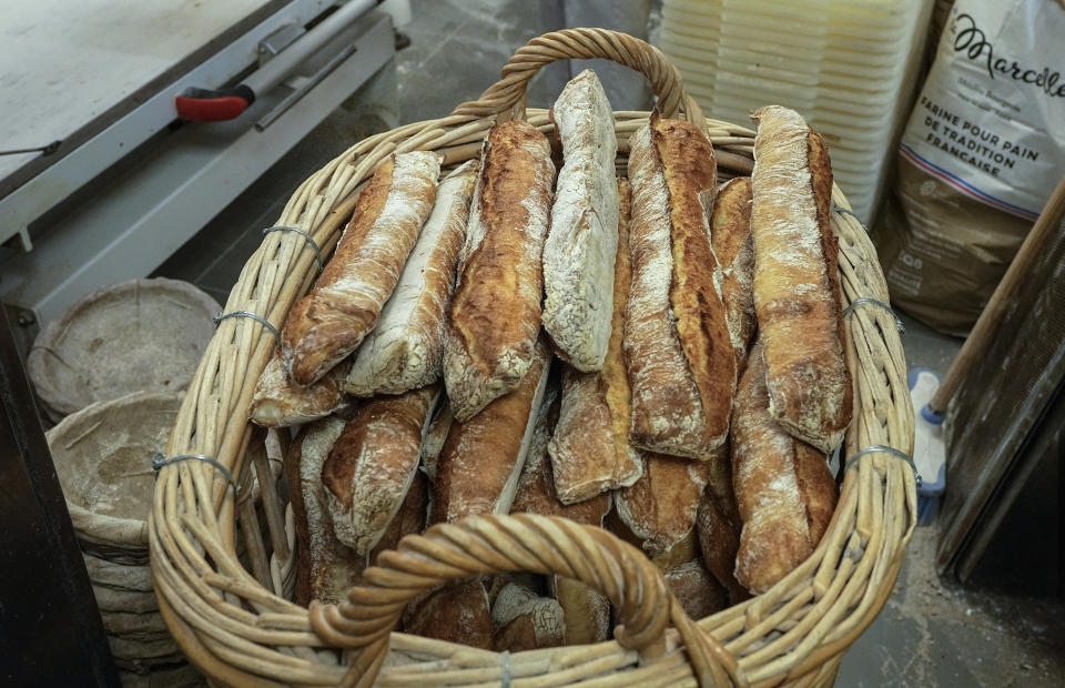 A basket of baguettes is ready to sold at Feru bakery in Louveciennes, west of Paris, Tuesday, Oct. 26, 2021. A worldwide increase in wheat prices after bad harvests in Russia is forcing French bakers to raise the price of that staple of life in France the baguette. Boulangeries around France have begun putting up signs warning their customers of an increase in the price of their favorite bread due to rising costs. (AP Photo/Michel Euler