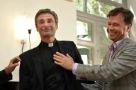 Father Krysztof Olaf Charamsa (L), who works for a Vatican office, gives a press conference with his partner Edouard to reveal his homosexuality on October 3, 2015 in Rome