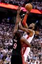 Toronto Raptors forward DeMarre Carroll (5) shoots over Miami Heat forward Luol Deng (9) in game two of the second round of the NBA Playoffs at Air Canada Centre. The Raptors won 96-92. Mandatory Credit: Dan Hamilton-USA TODAY Sports