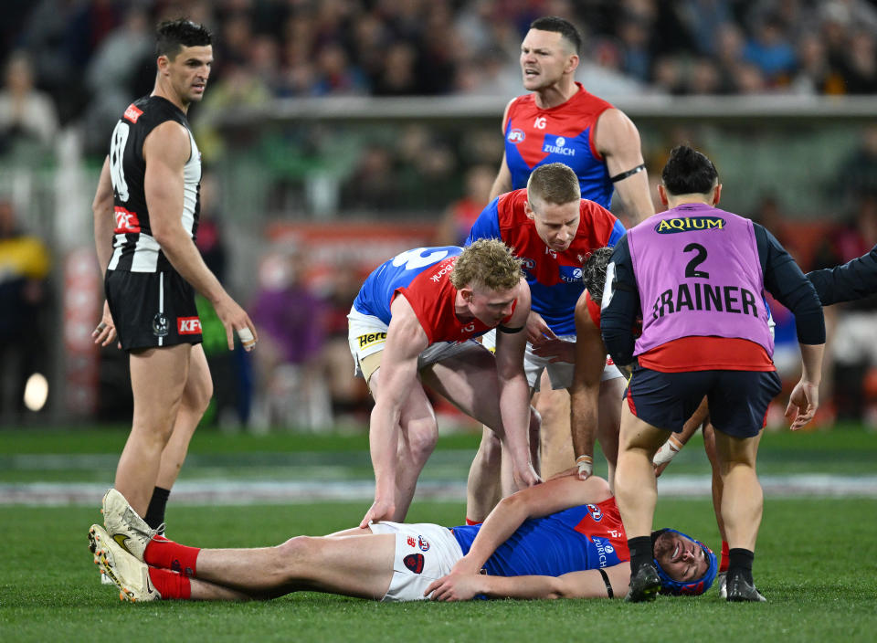 MELBOURNE, AUSTRALIA - SEPTEMBER 07: Angus Brayshaw of the Demons lays on the ground knocked out during the AFL First Qualifying Final match between Collingwood Magpies and Melbourne Demons at Melbourne Cricket Ground, on September 07, 2023, in Melbourne, Australia. (Photo by Quinn Rooney/Getty Images)