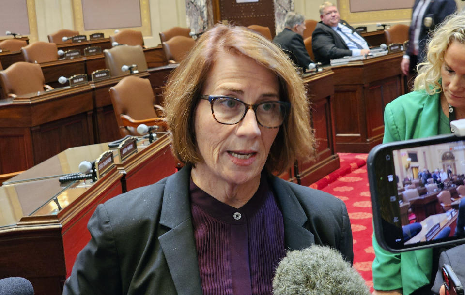 Minnesota Senate Democratic Majority Leader Erin Murphy talks with reporters on the Senate floor in the Minnesota State Capitol after a Republican attempt to expedite an ethics investigation of Democratic Sen. Nicole Mitchell, who's facing a felony burglary charge, failed on a tie vote, Wednesday, April 24, 2024 in St. Paul, Minn. (AP Photo/Steve Karnowski)