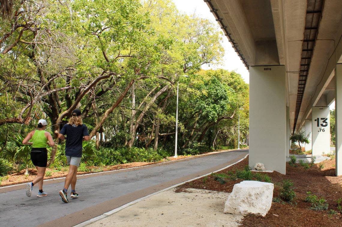 Joggers run on the Hammock Trail section in Brickell of a new, two-mile section of The Underline that opens on April 24, 2024.