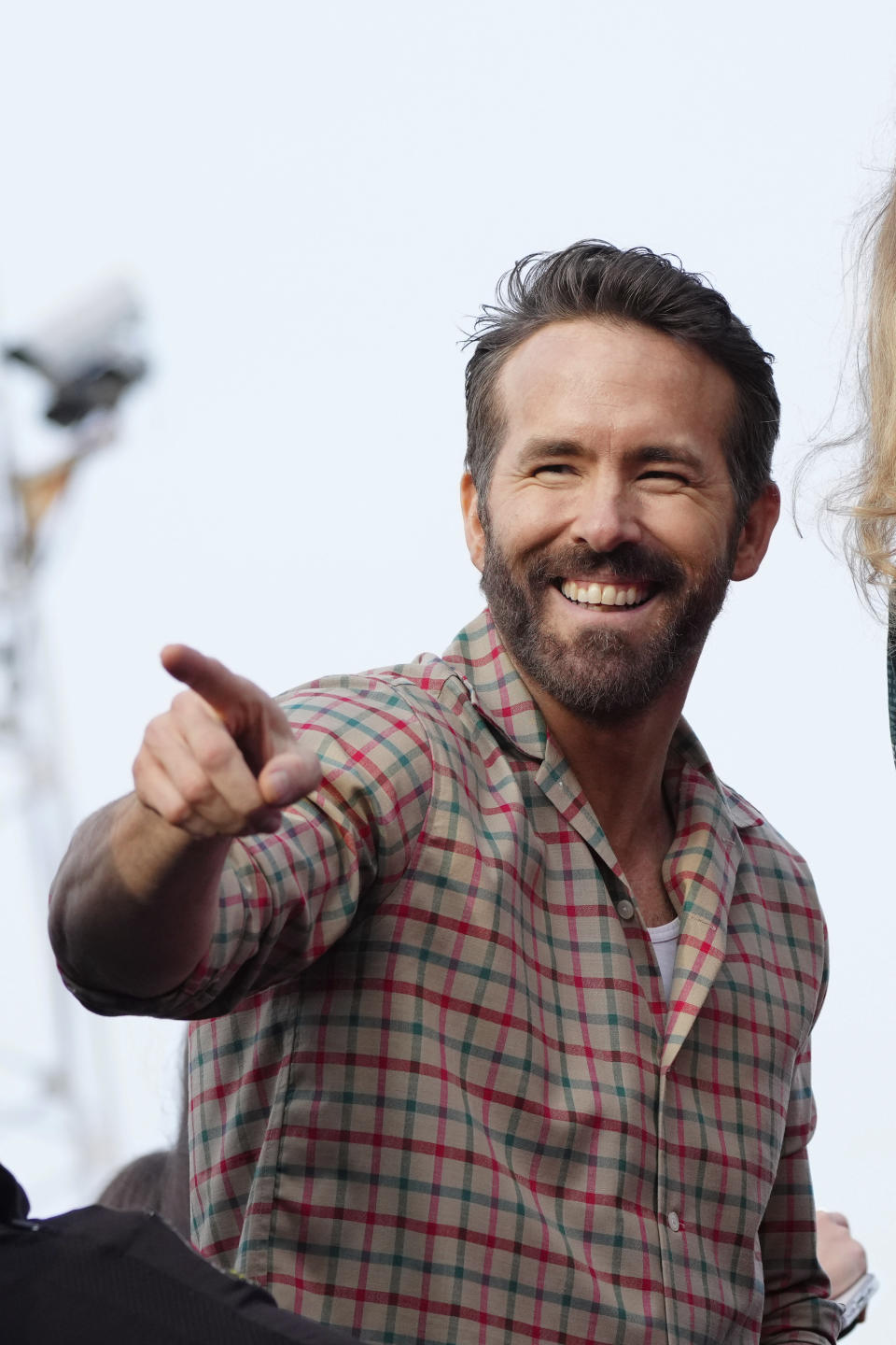 Wrexham co-owner Ryan Reynolds celebrates with members of the Wrexham FC soccer team the promotion to the Football League in Wrexham, Wales, Tuesday, May 2, 2023. (AP Photo/Jon Super)