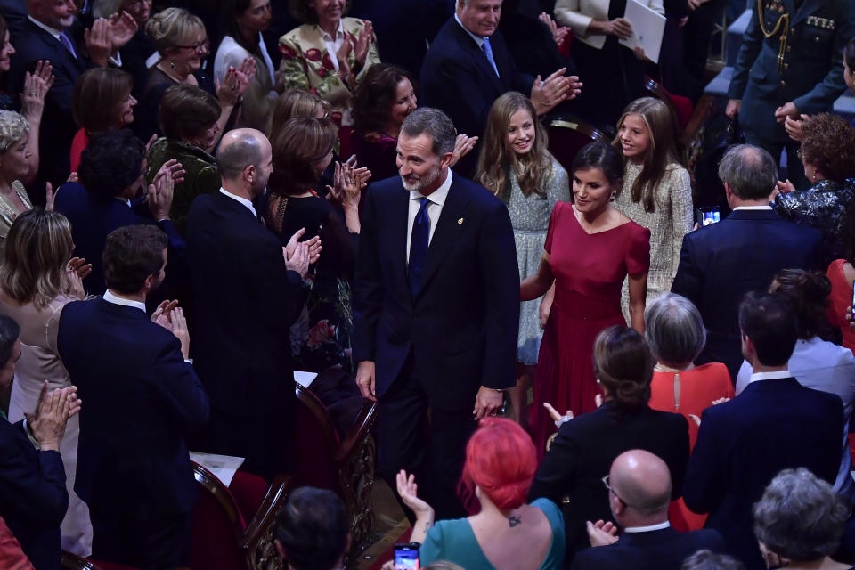 FILE - Spain's King Felipe VI and Queen Letizia, with Princess of Asturias Leonor, back left, and Sofia, at the end of Princess of Asturias Awards, in Oviedo, northern Spain, Friday Oct. 18, 2019. The Spanish government is set to pass a decree Tuesday aimed at boosting transparency in a monarchy still reeling from scandals involving King Felipe VI's father, Juan Carlos. The move comes a day after Felipe made public his personal assets of €2.6 million euros ($2.8 million) for the first time ever. (AP Photo/Alvaro Barrientos, File)