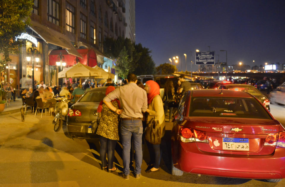 Egyptians relax outside a cafe in Cairo, Egypt, Wednesday, Oct. 31, 2012. Egypt’s capital prides itself on being city that never sleeps, with crowds filling cafes and shops open into the small hours. So the government is facing a backlash from businesses and the public as it vows to impose new nationwide rules closing stores and restaurants early. Officials say the crisis-ridden nation has to conserve electricity, but they also seem intent on taming a population they see as too unruly. (AP Photo)