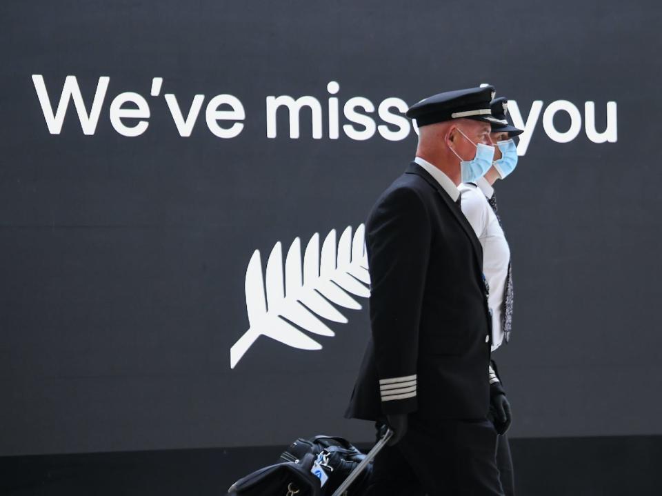 Air New Zealand pilots arrive at the Sydney International Airport.