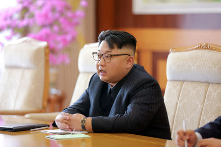 North Korean leader Kim Jong Un meets Salvador Antonio Valdes Mesa, member of the Political Bureau of the Central Committee of the Communist Party of Cuba (CPC) and vice-president of the Council of State of Cuba, and his party on a visit, in this undated photo released by North Korea's Korean Central News Agency (KCNA) July 1, 2016. REUTERS/KCNA